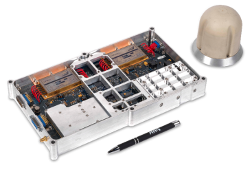 An image of the data terminal which TTP created: a square box containing complex hardware as described above. It is pictured alongside a pen of which the terminal is about double the length of. To its right is its omnidirectional satellite.